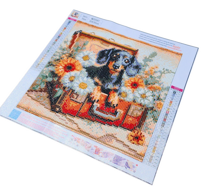 Finished Diamond Painting - Dachshund Puppy in Suitcase with Flowers